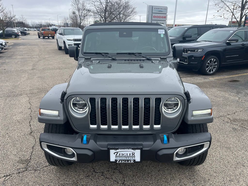 Used 2022 Jeep Wrangler Unlimited Sahara 4XE with VIN 1C4JJXP62NW113893 for sale in Schaumburg, IL
