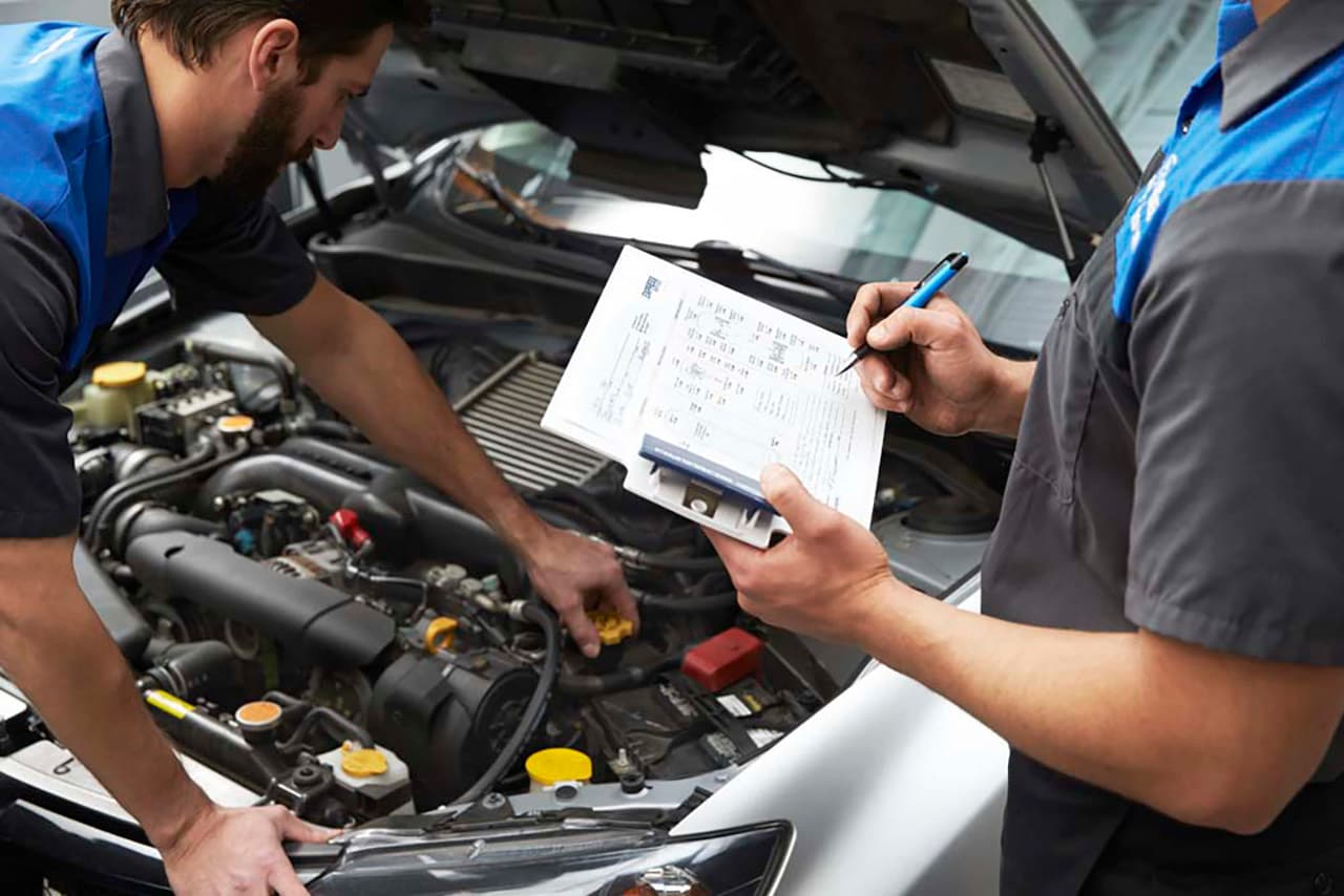 Subaru Service Technicians Fixing a Subaru Vehicle
