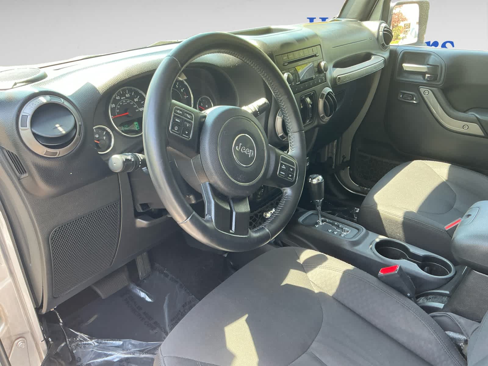 used 2015 Jeep Wrangler Unlimited car, priced at $14,998
