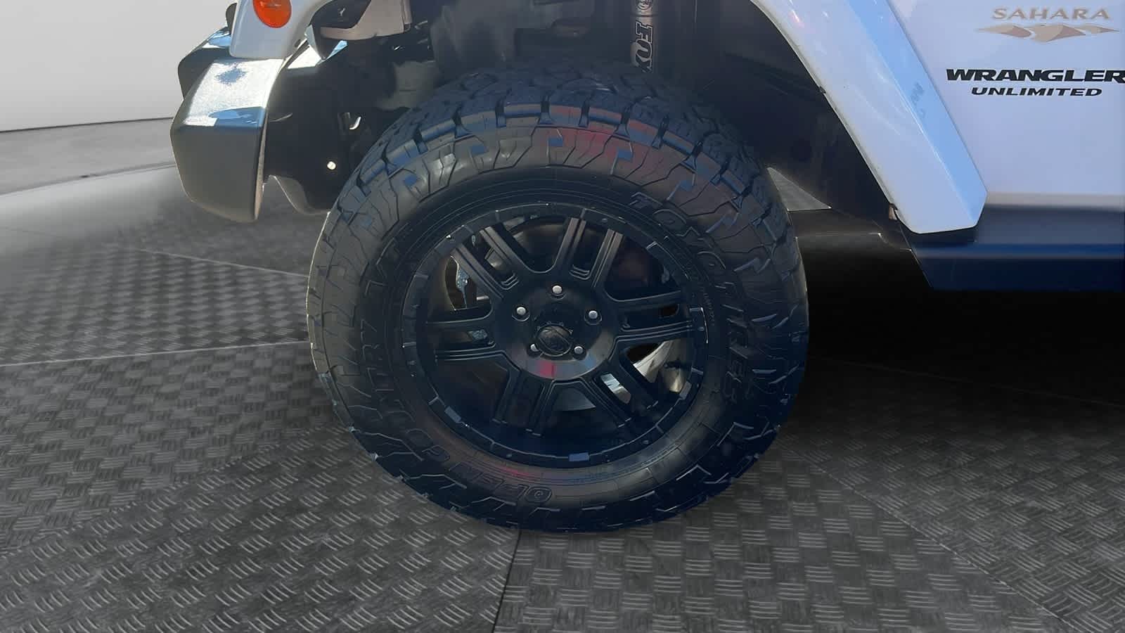 used 2014 Jeep Wrangler Unlimited car, priced at $15,942
