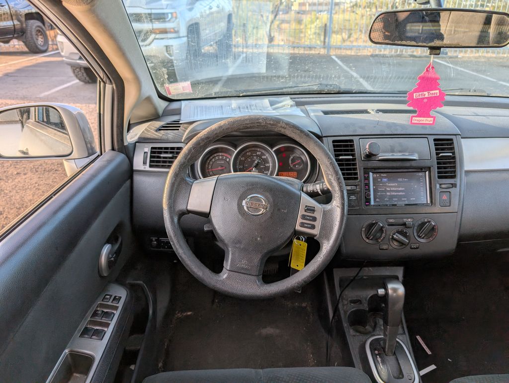 used 2011 Nissan Versa car, priced at $6,000